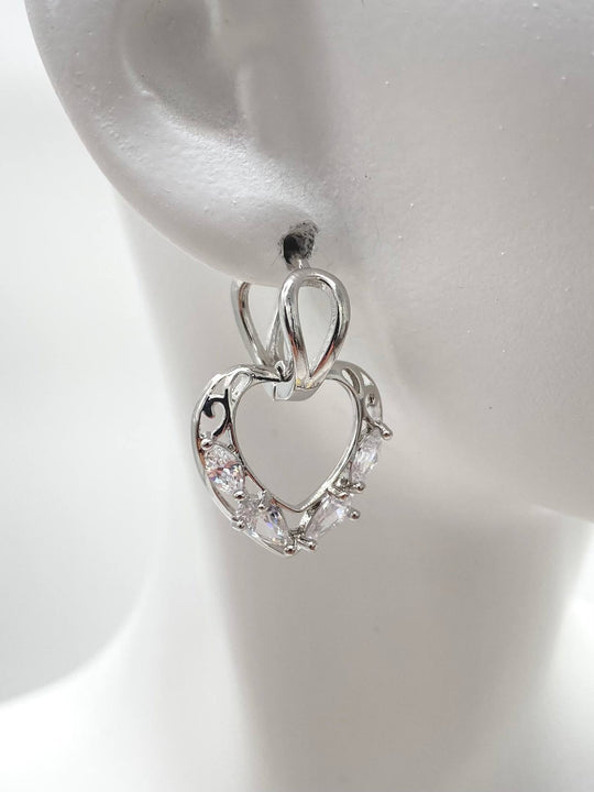 HUGGIE CORAZON COLGANTE CON ZIRCONIAS EN CHAPA DE RODIO