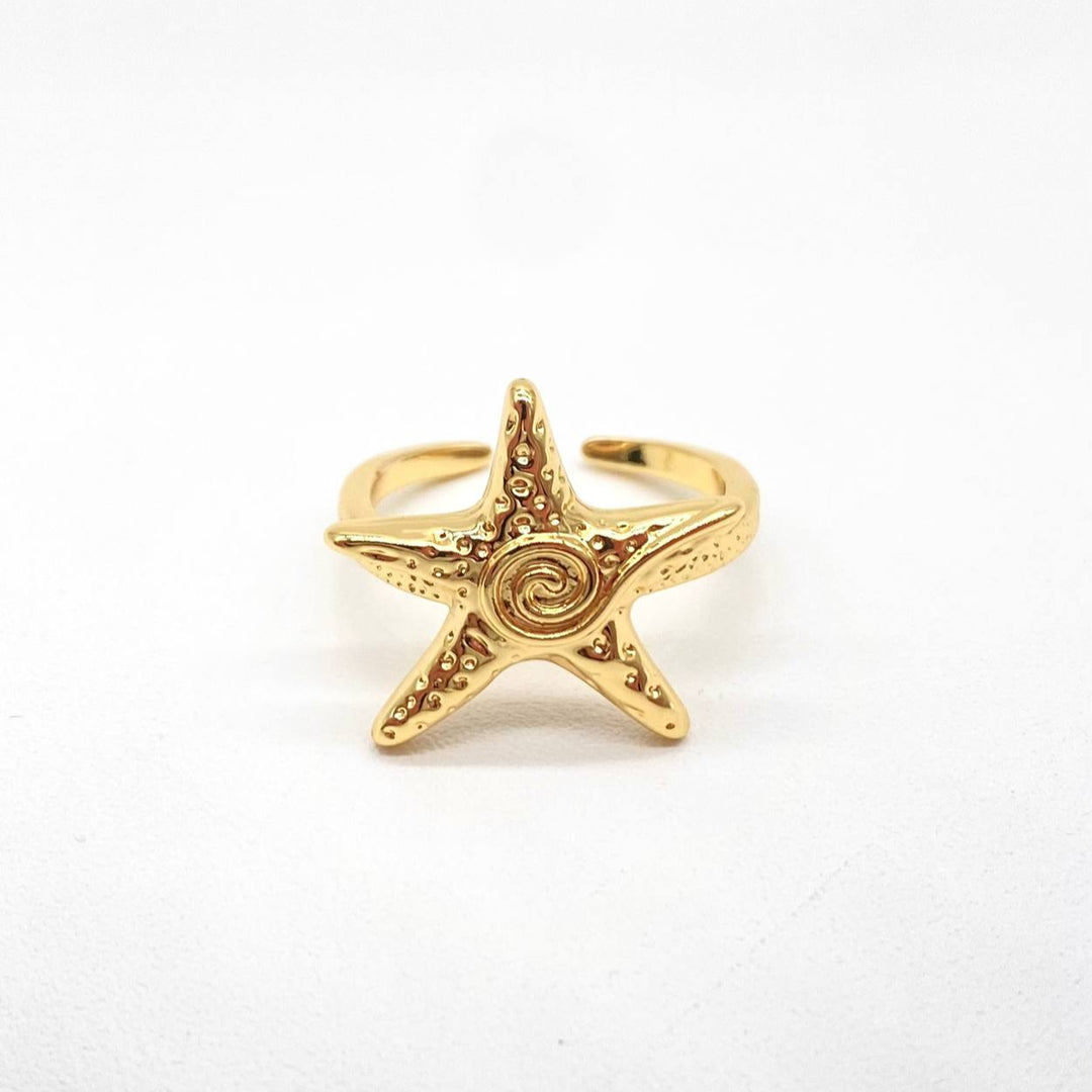 ANILLO ESTRELLA DE MAR CHAPA DE ORO 18K