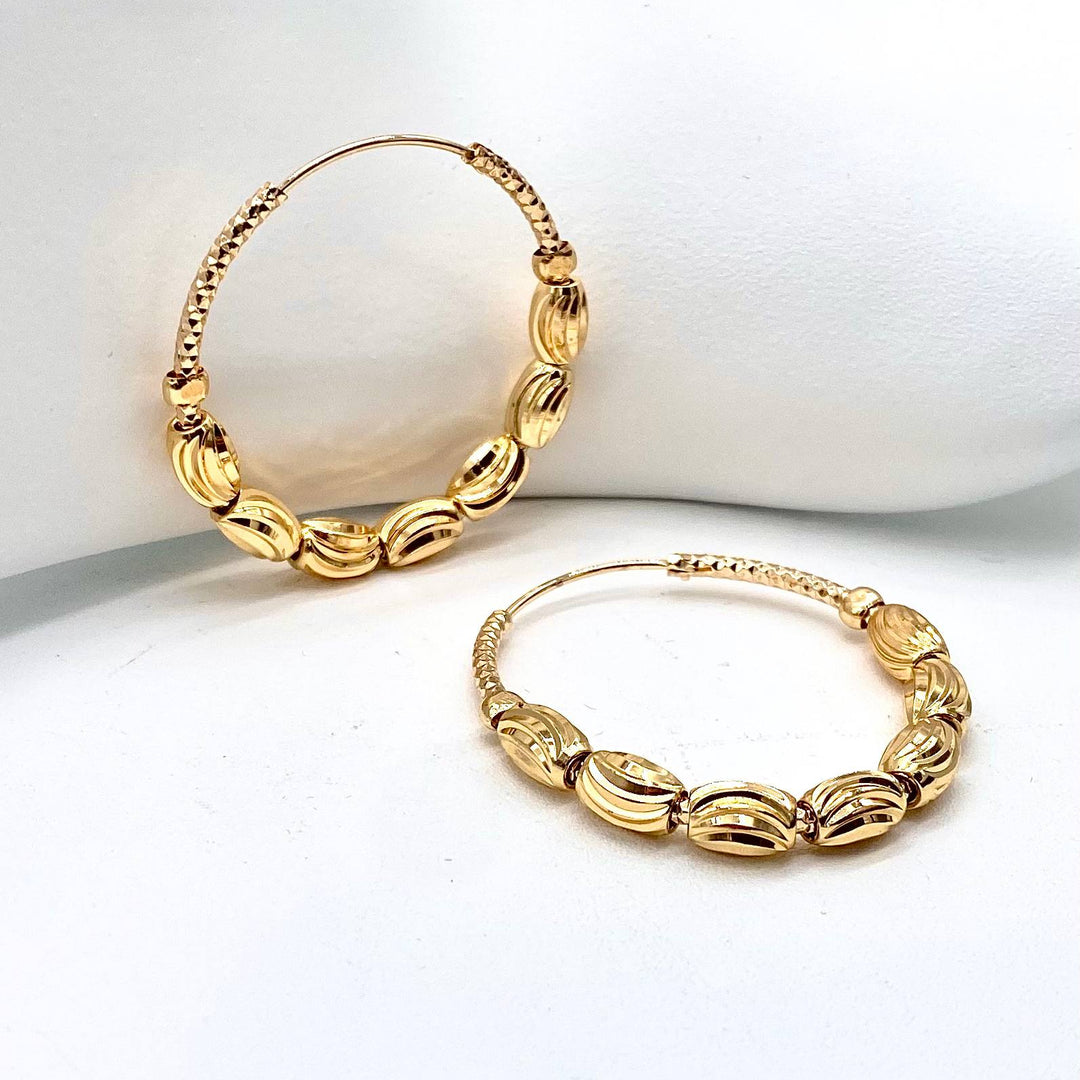 ARRACADA CON BALIS CHAPA DE ORO 18K