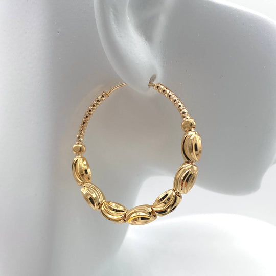 ARRACADA CON BALIS CHAPA DE ORO 18K