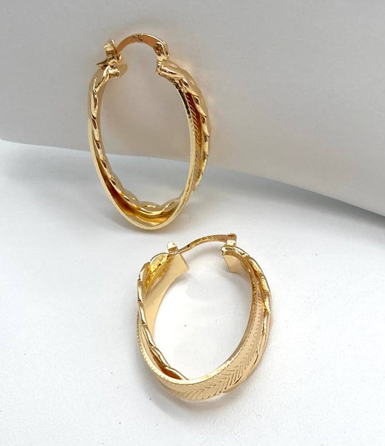 ARRACADA OVAL DOBLE CHAPA DE ORO 18K