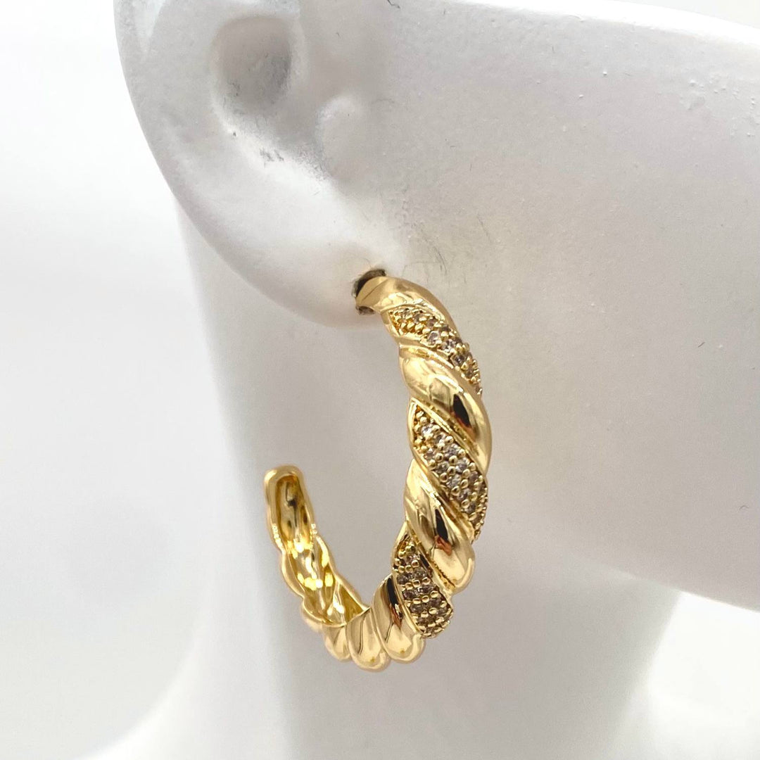 ARRACADA MEDIA TRENZADA CHAPA DE ORO 18K