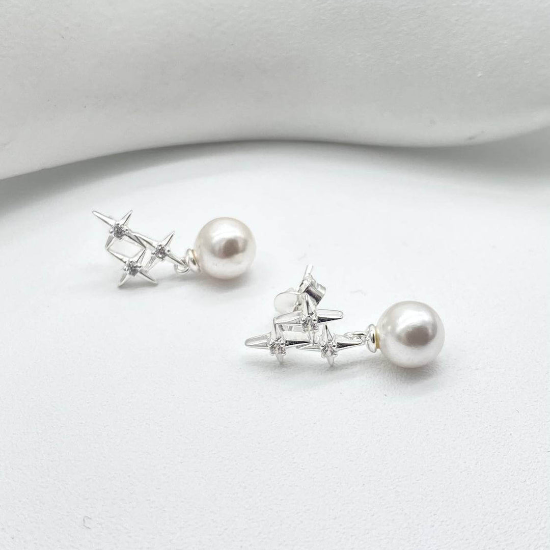 ARETE ESTRELLA CON PERLA PLATA 925