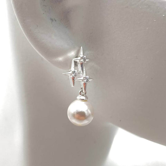 ARETE ESTRELLA CON PERLA PLATA 925