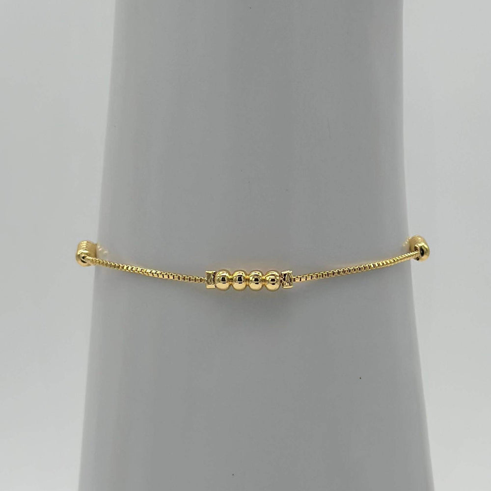 Pulsera Bolitas – Chapa de Oro 18K | MAEL
