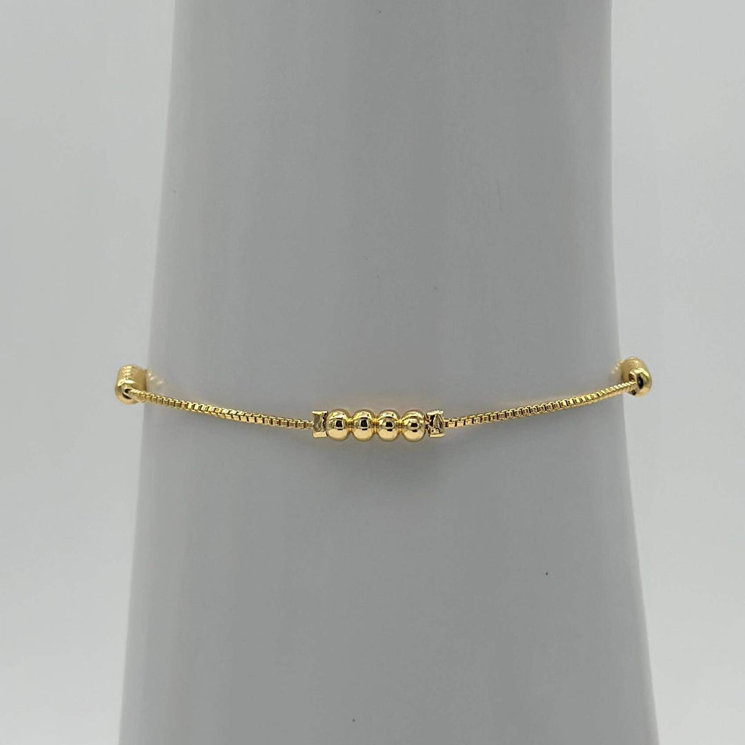 Pulsera Bolitas – Chapa de Oro 18K | MAEL