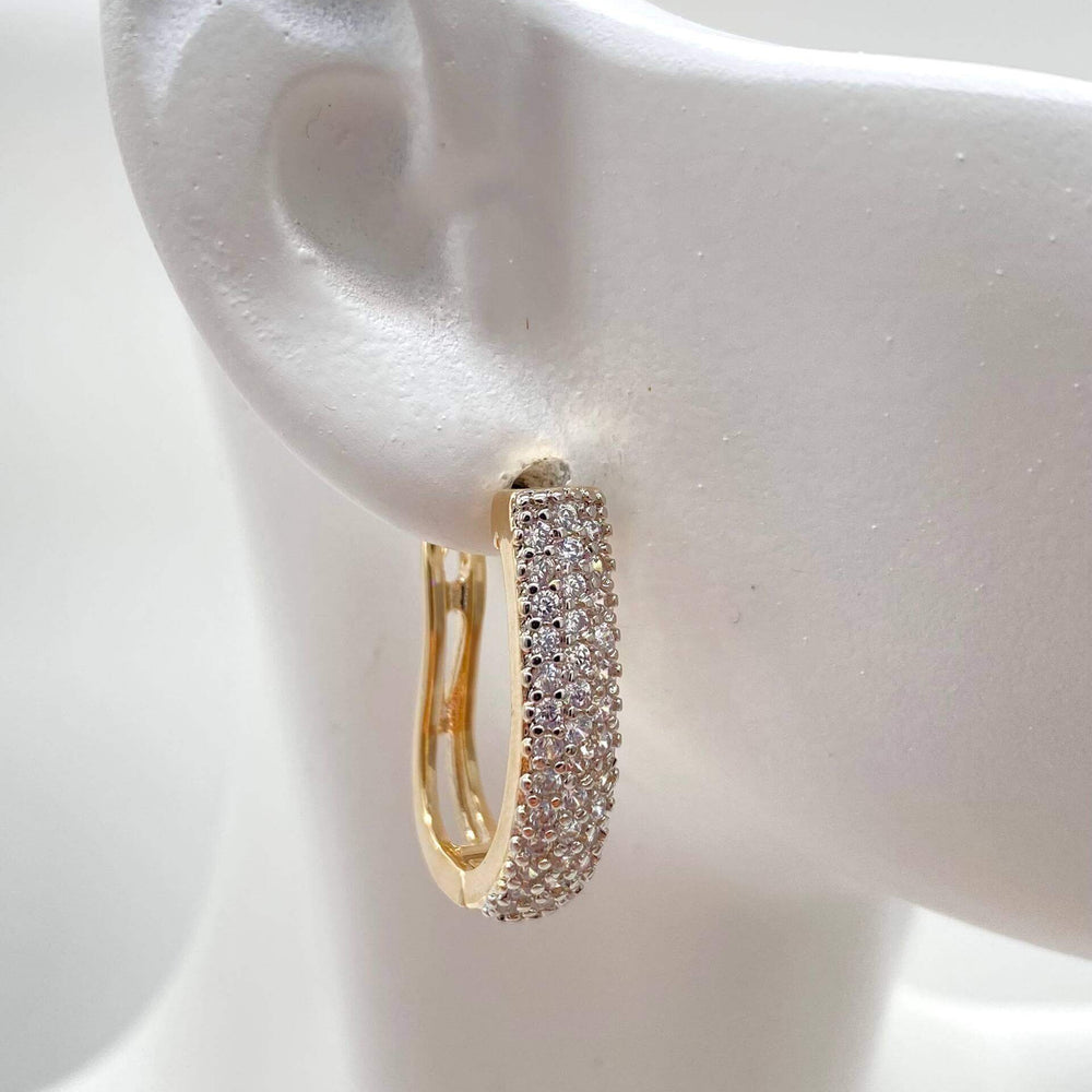 Huggie zirconias – Chapa de Oro 18K | MAEL