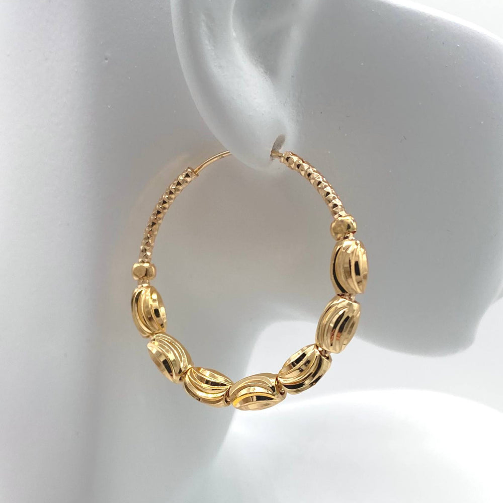 ARRACADA CON BALIS CHAPA DE ORO 18K