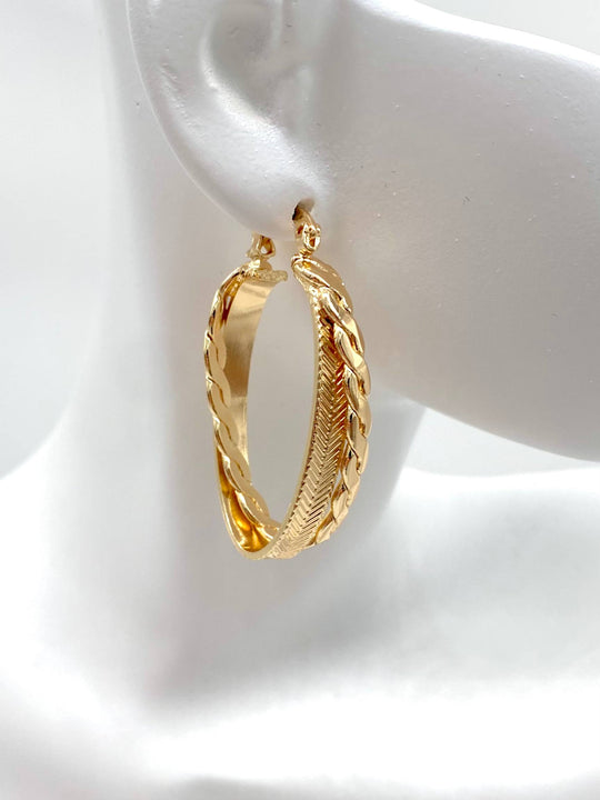 ARRACADA OVAL DOBLE CHAPA DE ORO 18K