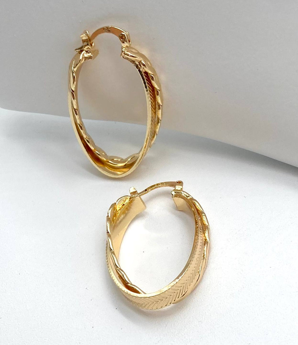 ARRACADA OVAL DOBLE CHAPA DE ORO 18K