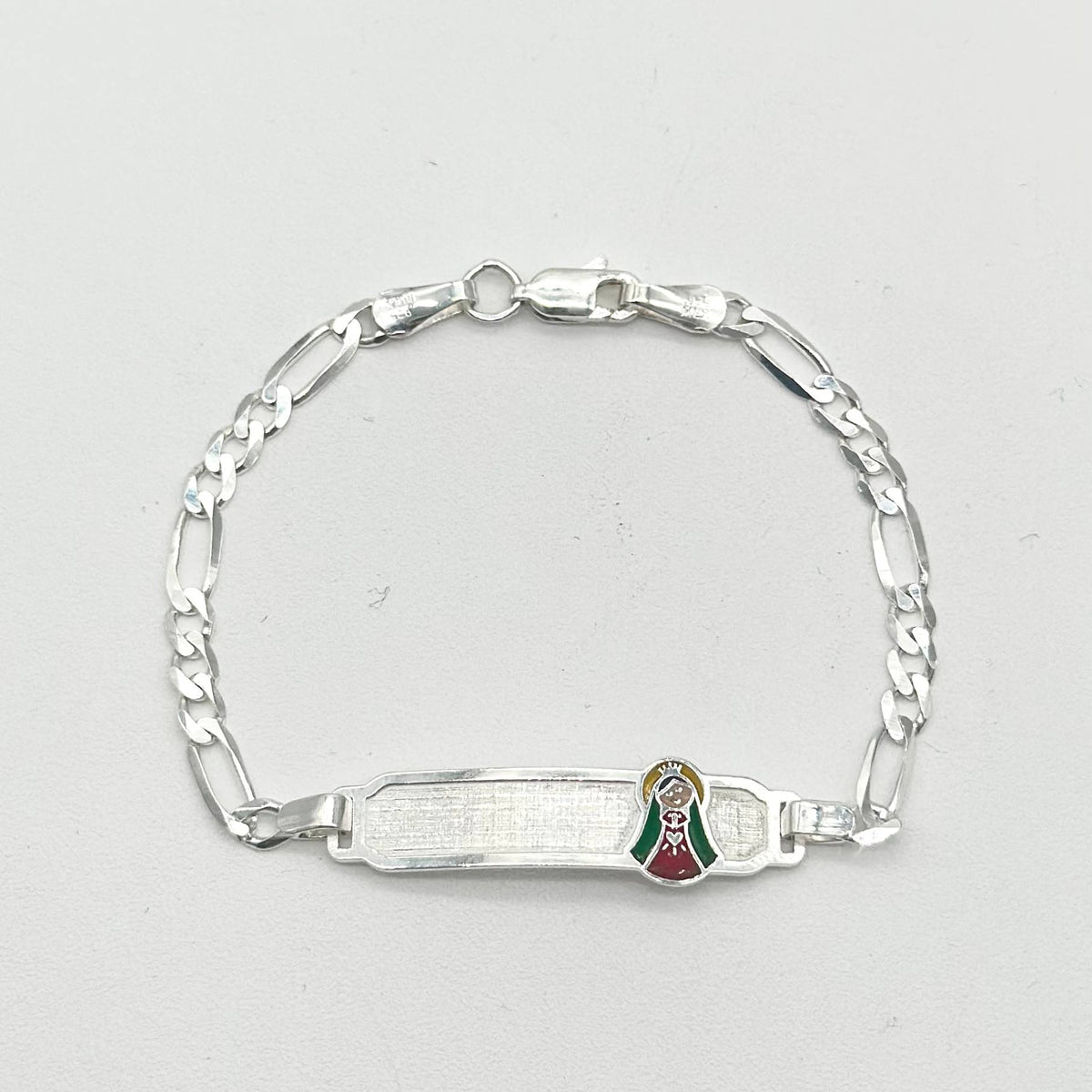 Pulsera de identidad con Virgen de Guadalupe elaborada en plata 925 mexicana, medida de 15 cm y cadena de 5 mm.