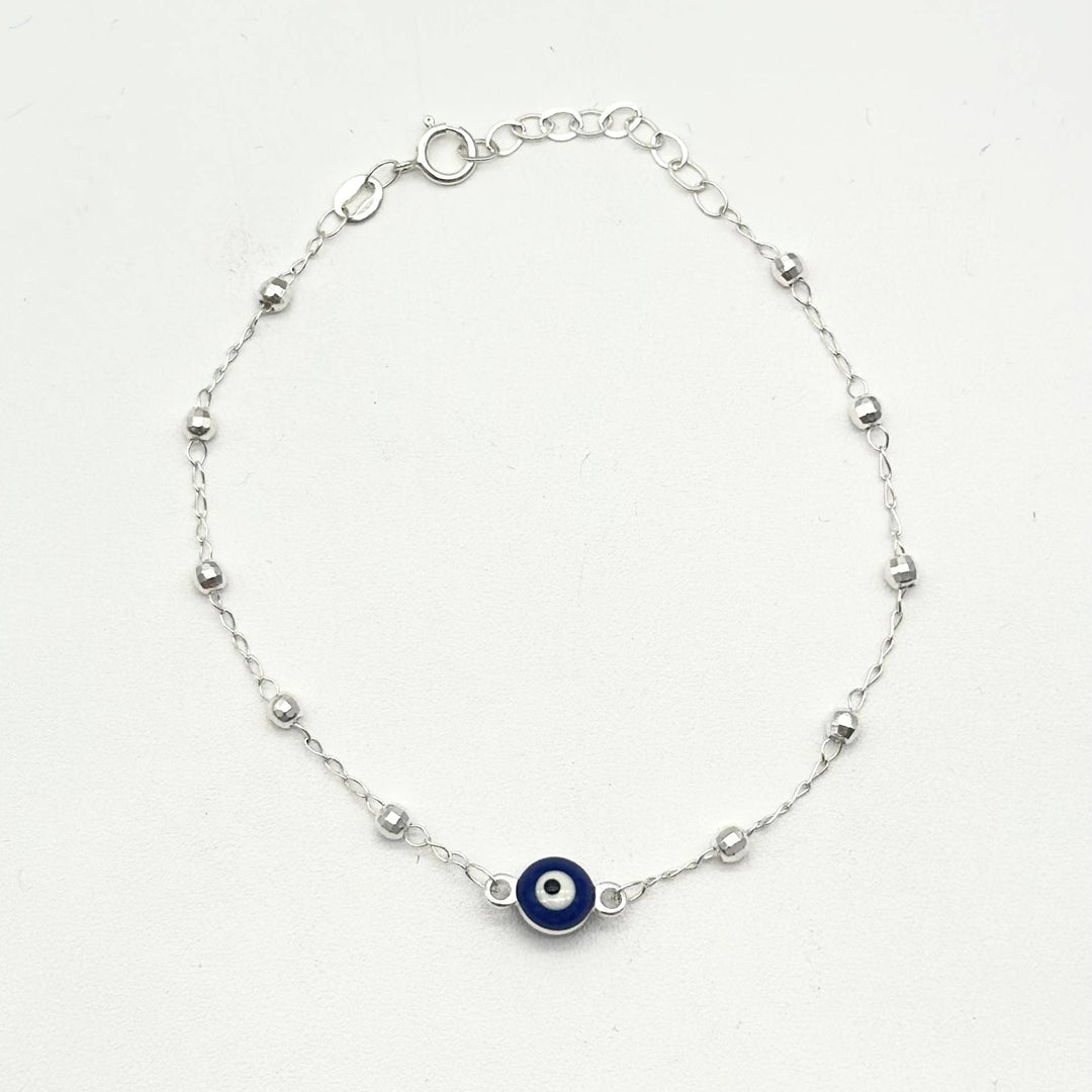 Pulsera de plata 925 con ojo turco azul central y bolitas facetadas, medida de 16 cm más 5 cm de extensión.