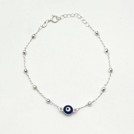 Pulsera de plata 925 con ojo turco azul central y bolitas facetadas, medida de 16 cm más 5 cm de extensión.
