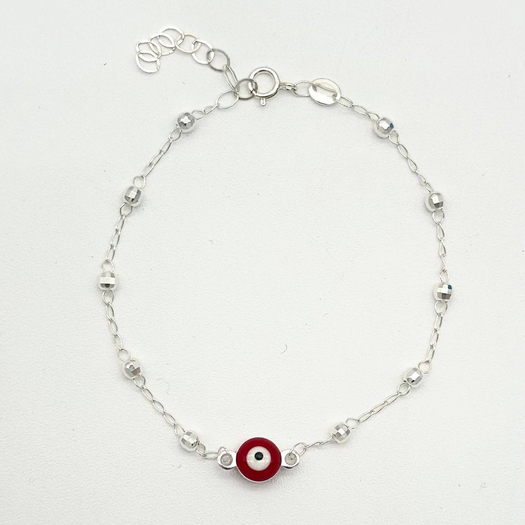 Pulsera de plata 925 con ojo turco rojo central y bolitas facetadas, medida de 16 cm más 5 cm de extensión.