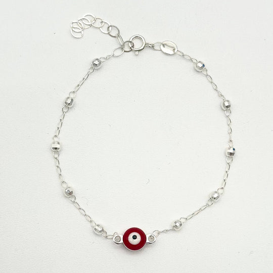 Pulsera de plata 925 con ojo turco rojo central y bolitas facetadas, medida de 16 cm más 5 cm de extensión.