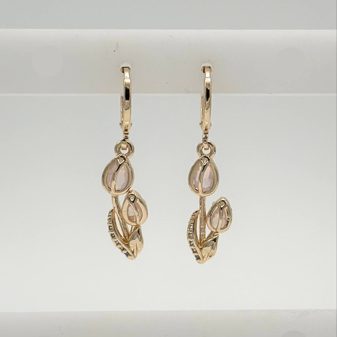 Aretes Huggie Tulipanes Chapa de Oro 18K | Mael Joyería