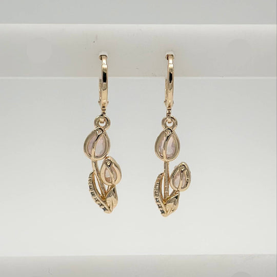 Aretes Huggie Tulipanes Chapa de Oro 18K | Mael Joyería